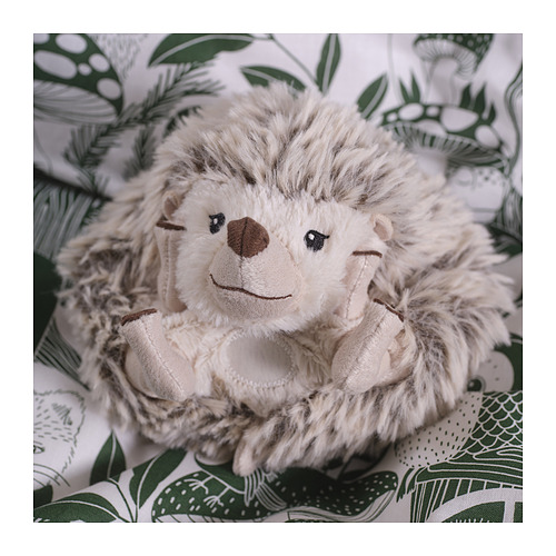Un erizo de peluche en tela estampada, suave y detallado, con bordados y una sonrisa amable y acogedora.