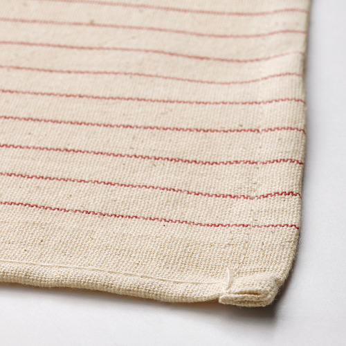 Tela de color crema con rayas rojas, cuidadosamente cosida, con textura de algodón de alta calidad.