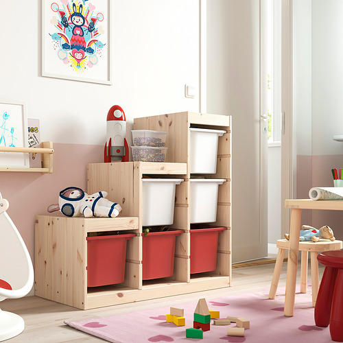 Wood TROFAST kids shelf with red bins, toys, and stuffed animal.