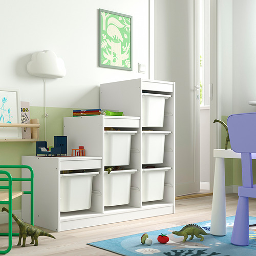 Sala de juegos para niños con almacenamiento TROFAST, contenedores, estantes, juguetes, tema de dinosaurios, alfombra azul, pared verde, póster de dinosaurio.