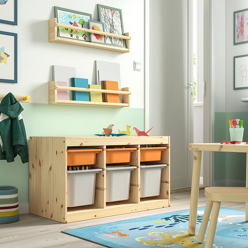 Kids room with TROFAST light wood storage; includes shelves, bins, and boxes for organizing toys and art supplies.