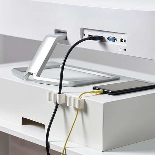 Los soportes para cables KALKSTUFF mantienen los cables ordenados, organizando el escritorio y la tecnología con facilidad. Los soportes blancos se adhieren a las superficies, gestionando los cables de los dispositivos.