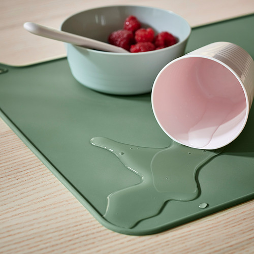 Mantel individual de silicona verde con diseño de gato. Protege las mesas de los derrames y mantiene su lugar.