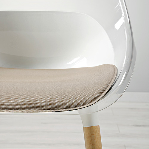 Silla moderna con elegante carcasa de asiento transparente, patas de madera robustas y cojín cómodo.
