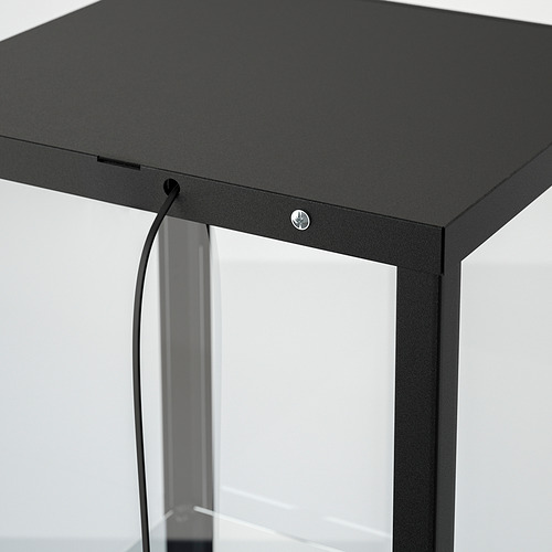 Mueble con puerta de cristal negro con gestión de cables de iluminación integrada, con un diseño elegante y un estilo moderno.