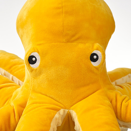 Peluche de pulpo amarillo brillante suave con ojos negros, perfecto para abrazar. Los materiales reciclados garantizan durabilidad y seguridad.