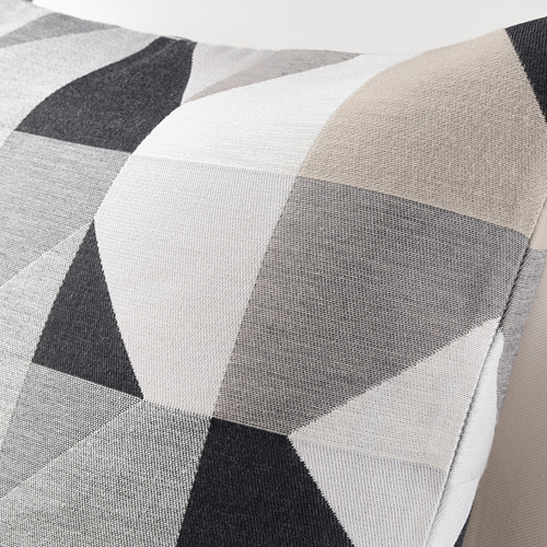 Funda de cojín geométrica, tejido jacquard, textura gruesa. Colores blanco, gris, beige. Detalle de cremallera.