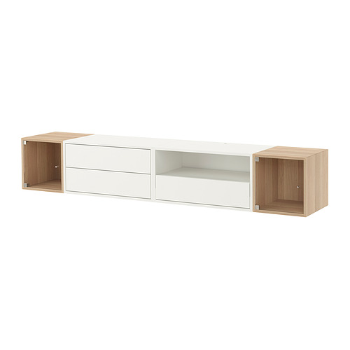 Modern wall-mounted shelf unit, named EKET, white with natural wood accents, combining open and closed storage with sleek design.