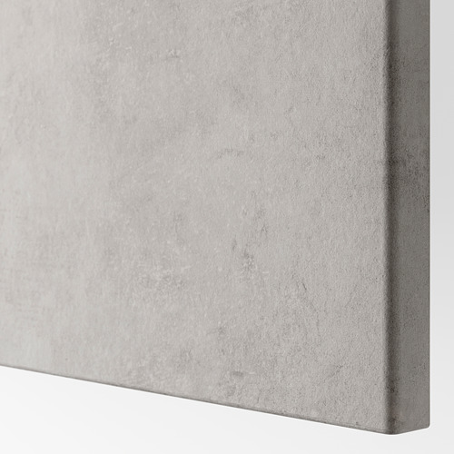 Primer plano de la superficie lisa de BESTÅ gris claro con efecto texturizado.