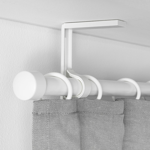 Soporte de barra de cortina ajustable blanco montado en la pared, que soporta cortinas de color gris claro.