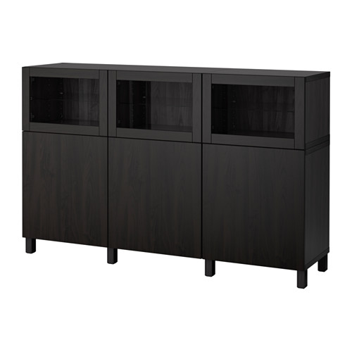 Mueble de almacenaje BESTÅ negro, diseño de madera oscura, dos estantes, cuatro puertas, tapa de cristal.