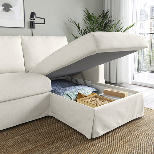 Sofá moderno con tumbona elevable para almacenamiento en el interior. Cojines mullidos, amplios y funcionales.