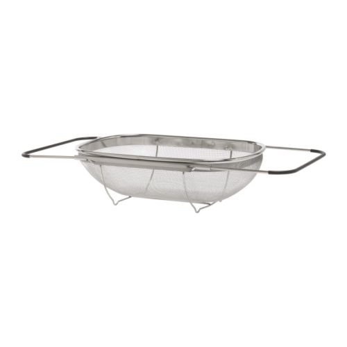 Colador de acero inoxidable con asas ajustables, apto para el uso en el fregadero de la cocina.