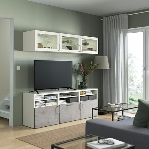 Sala de estar moderna con mueble de TV BESTÅ, TV de pantalla plana, sofá y mesa de centro.