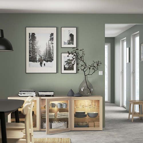 Modern dining room with BESTÅ sideboard, dishes, and chairs.