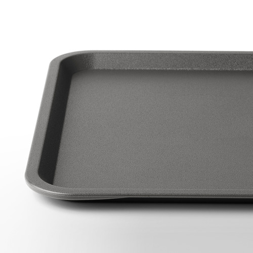 La imagen muestra una elegante bandeja rectangular negra con bordes lisos y angulados. La superficie parece limpia, duradera y libre de arañazos.