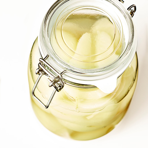 Tarro de cristal con tapa hermética, ideal para conservar alimentos y bebidas. Transparente, fácil de limpiar.