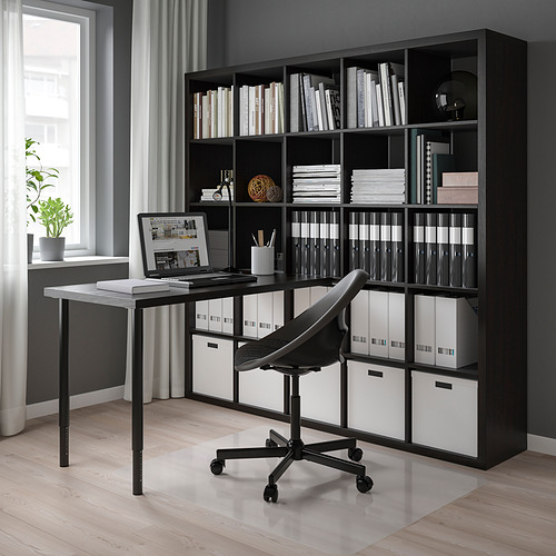 Home office: KALLAX shelf, desk, chair, window with plant.