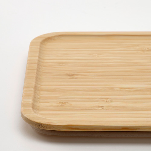 Tapa de bambú con bordes lisos y redondeados para recipiente de alimentos, que muestra el grano natural y la artesanía de calidad.
