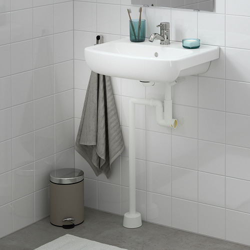 Lavabo BJÖRKÅN blanco moderno, grifo cromado, soporte azul, toalla gris, papelera plateada.