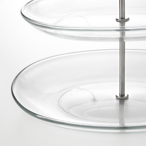 Soporte de servicio de vidrio con soportes de acero, platos apilados.