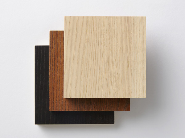 Square wood veneer swatches in light, medium, and dark finishes on a white background.