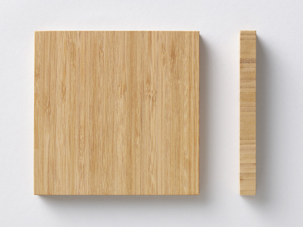 Square sample and side profile of a light bamboo board on a white background.