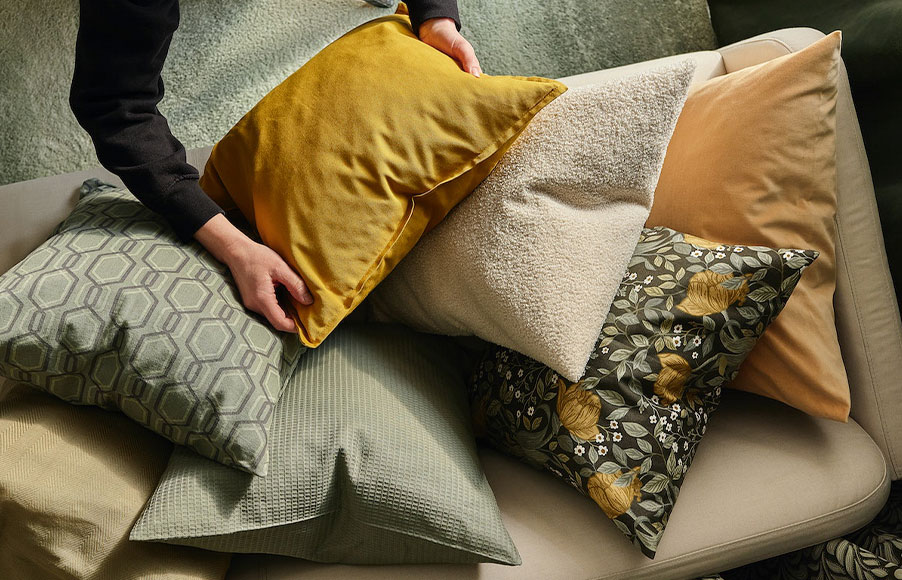 Top view of a LINANÄS 2-seat sofa with several cushions on top.