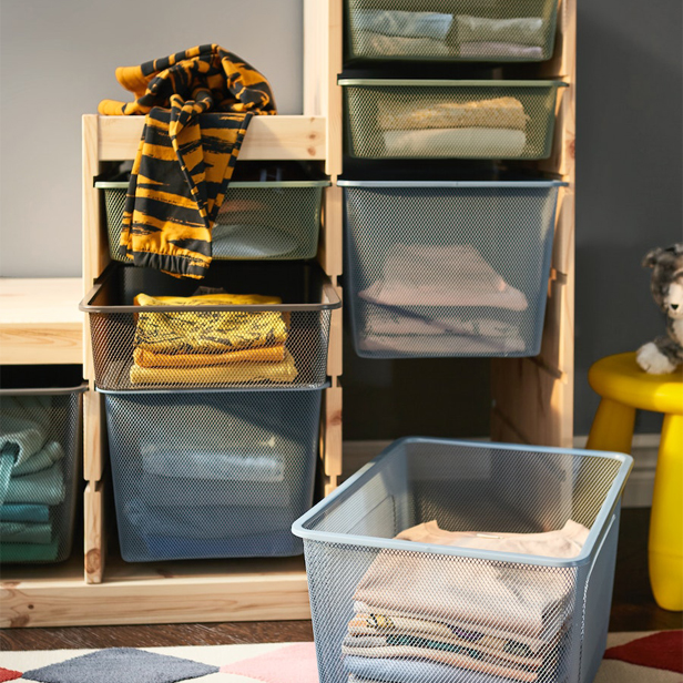 The TROFAST storage system with TROFAST wire boxes and a yellow MAMMUT stool to the right.