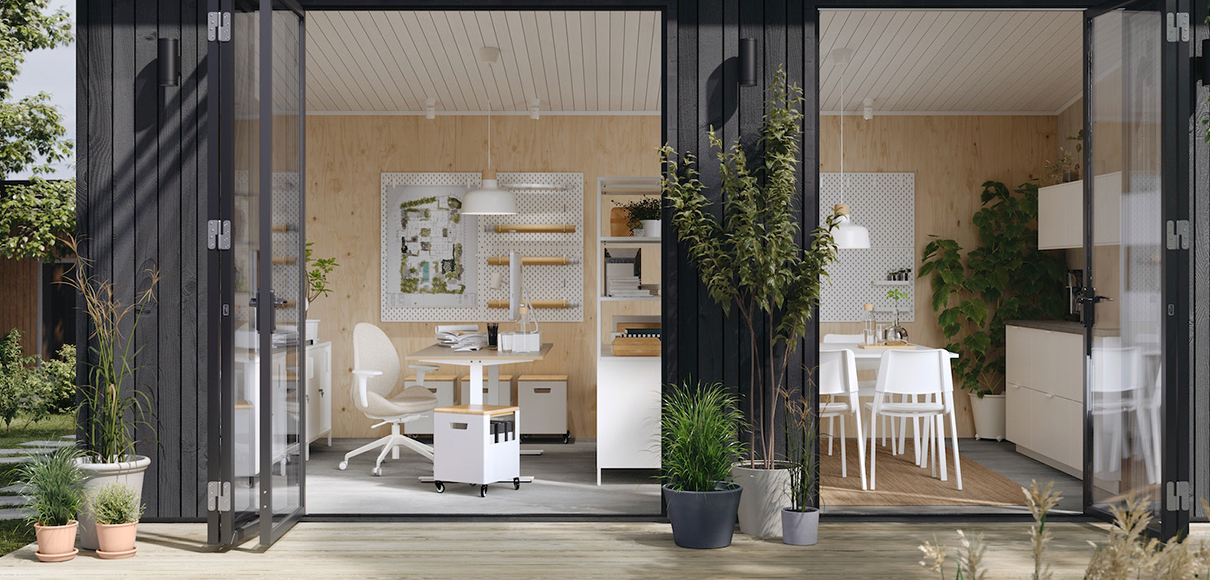 A workspace area with TROTTEN cabinets with sliding doors, METOD cabinet base with 2 drawers, TROTTEN desks, and TEODORES chairs.