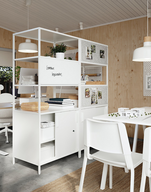 An office with a TROTTEN cabinet with sliding doors and, to the right, a TROTTEN table with TEODORES chairs.