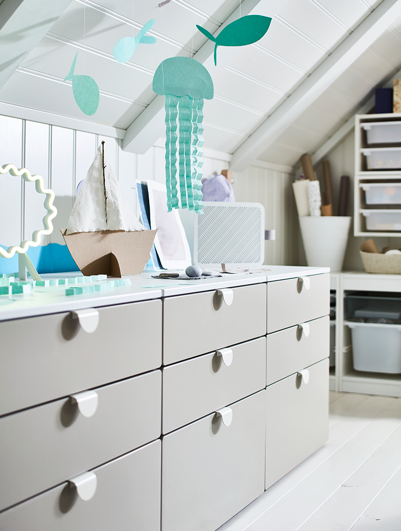 Three SMÅSTAD/PLATSA drawer units aligned with LATMASK handles and a TROFAST wall-mounted storage structure.