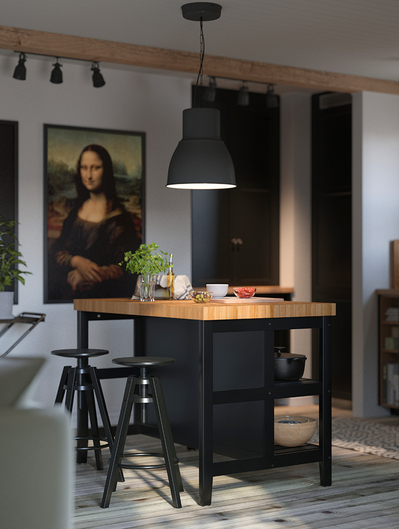 Kitchen island with black base and oak worktop, with high stools, the atmosphere is elegant in chiaroscuro colors, there is a picture of the Mona Lisa on the wall.