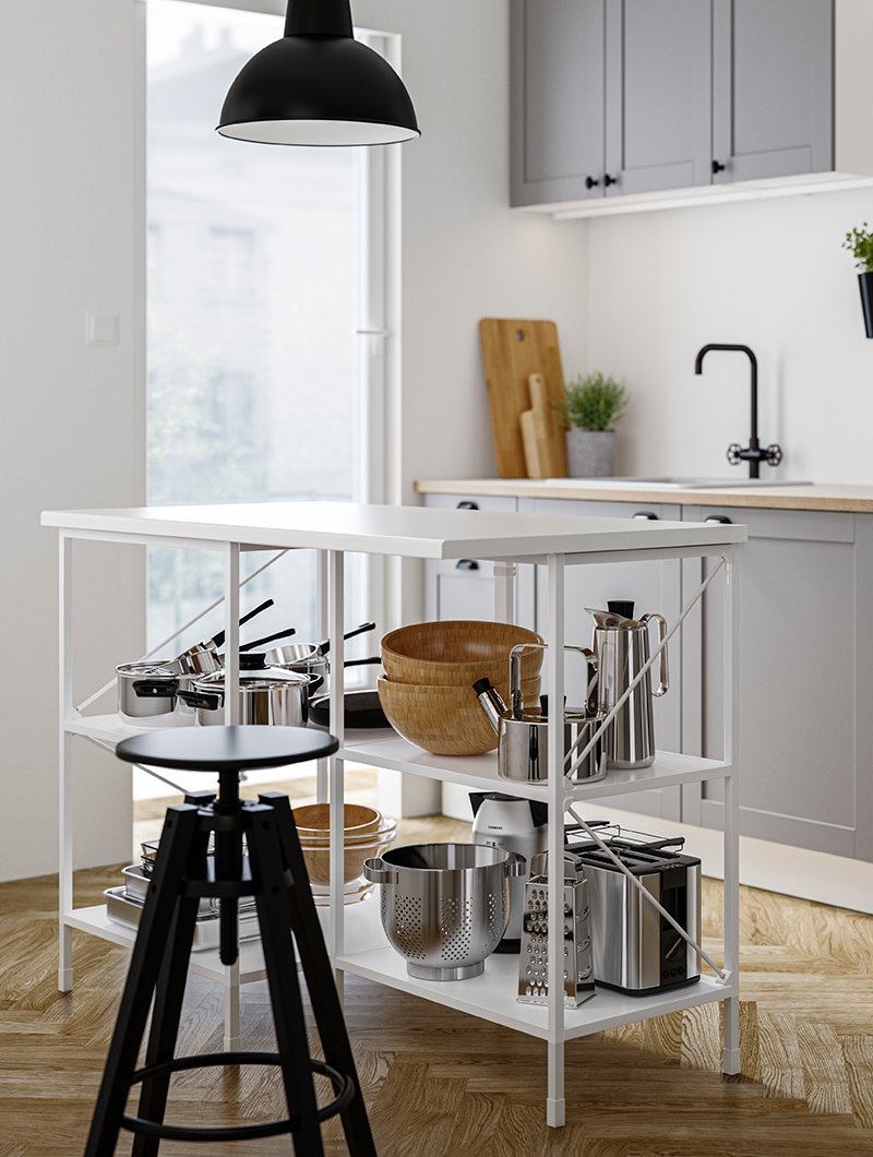 Isla de cocina modeerna con marco de metal blanco con grandes ollas y sartenes debajo hay un taburete negro alto.