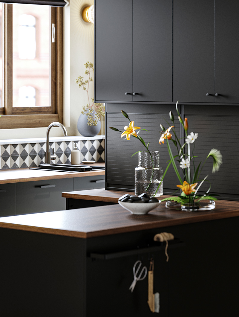 Encimera de base negra con tapa de madera oscura, el ambiente es oscuro y lúgubre.