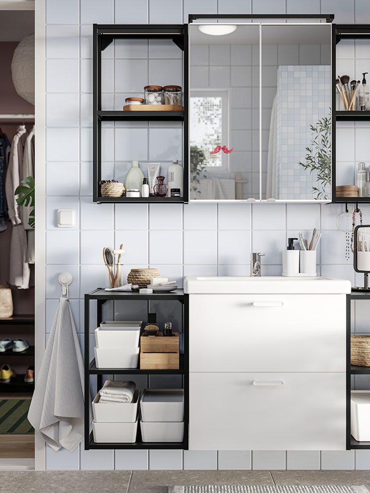 Bathroom with ENHET/TVÄLLEN bathroom cabinet, SAXBORGA lidded jars, STORAVAN bathroom set, FREDRIKSJÖN hand towel, and LINDBYN table mirror.