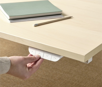 Detail of the height-adjustable desk knobs