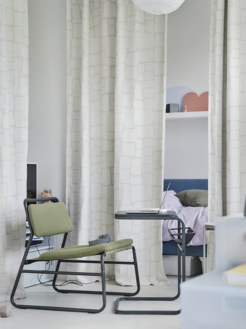 Studio apartment with OLSERÖD side table and  LÖNNSTÄVMAL blackout curtains.