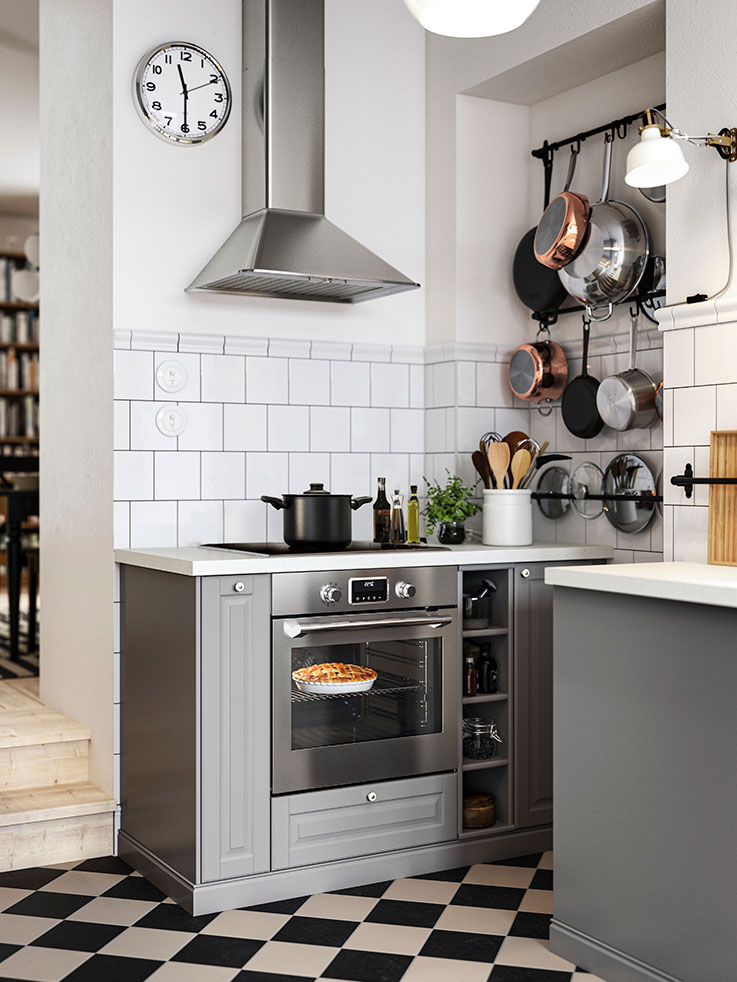 Kitchen with a FORNEBY convection oven, MATTRADITION extractor hood, and a METOD wall cabinet.