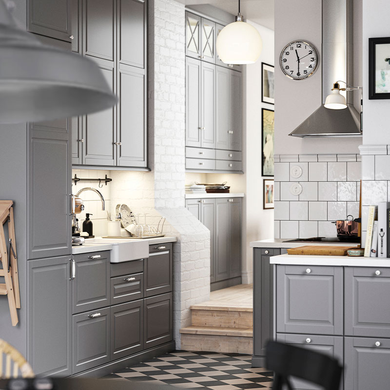 Dark gray kitchen with METOD wall cabinet, MATTRADITION extractor hood, and JÄRPLIDEN pendant lamp.