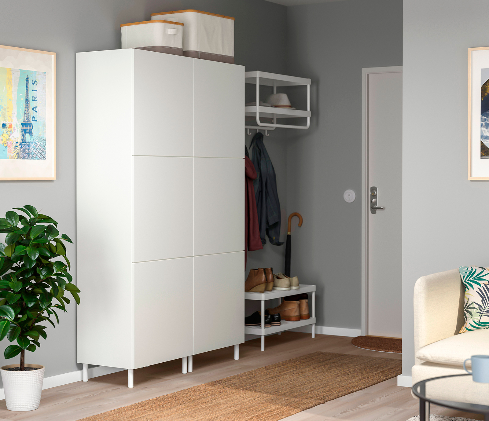 Room with a PLATSA wardrobe with 6 doors at the back, MACKAPÄR shoe organizer, VITTSJÖ coffee table, and RÖDALM picture.