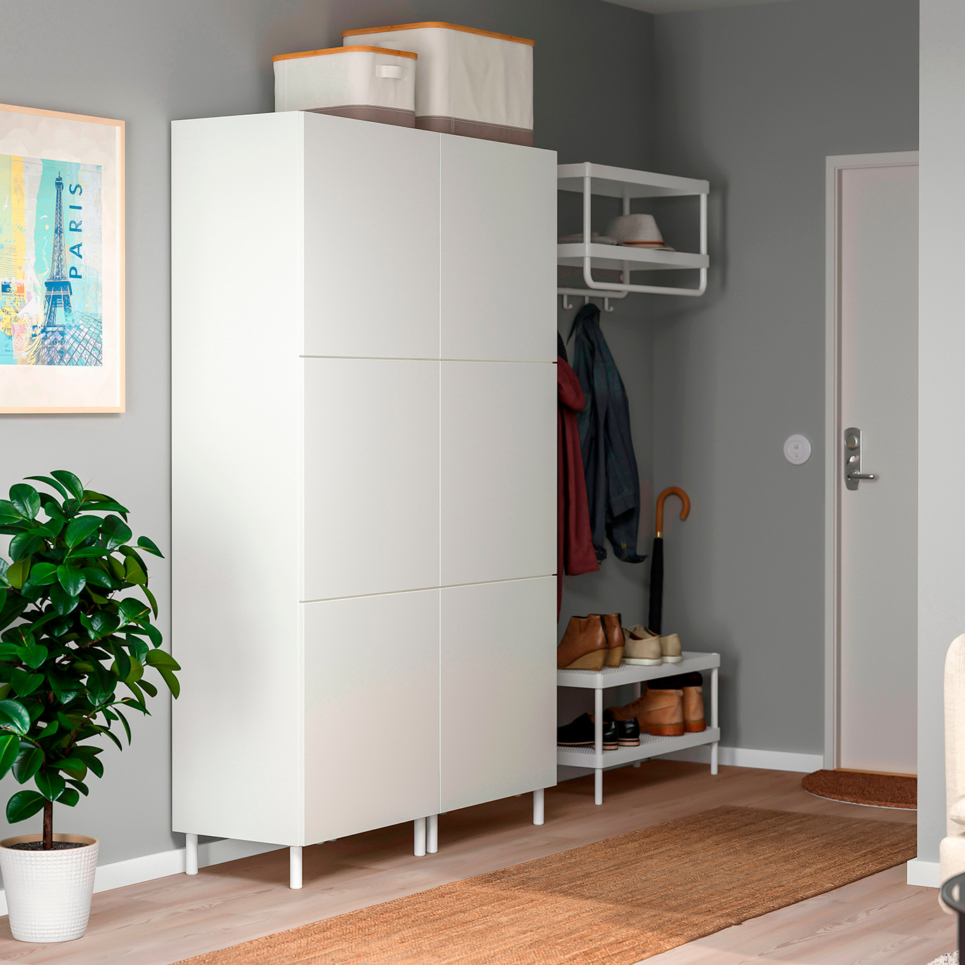 Room with a PLATSA wardrobe with 6 doors at the back, MACKAPÄR shoe organizer, VITTSJÖ coffee table, and RÖDALM picture.