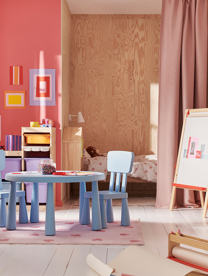   A set of MAMMUT children's chairs and table with several TROFAST storage boxes in the background
