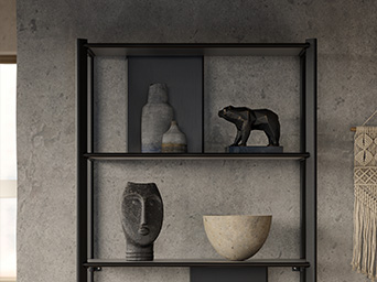 Minimalist metal shelf with decorative sculptures in neutral tones against a gray wall background.
