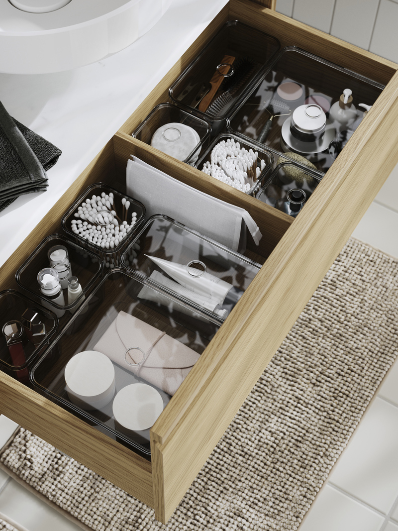 Several bathroom accesories organized in VISSLAÅN box with lid  inside a ÄNGSJÖN sink cabinet
