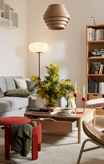 FÖRLUNDA Pouffe with storage,  KIVIK  sofa with chaiselongue and  FRYKSÅS Armchair in the living  room
