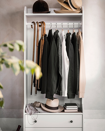 Open hallway wardrobe with hanging space, a shelf for hats, and drawers below—everything you need to keep coats, accessories, and shoes in order.