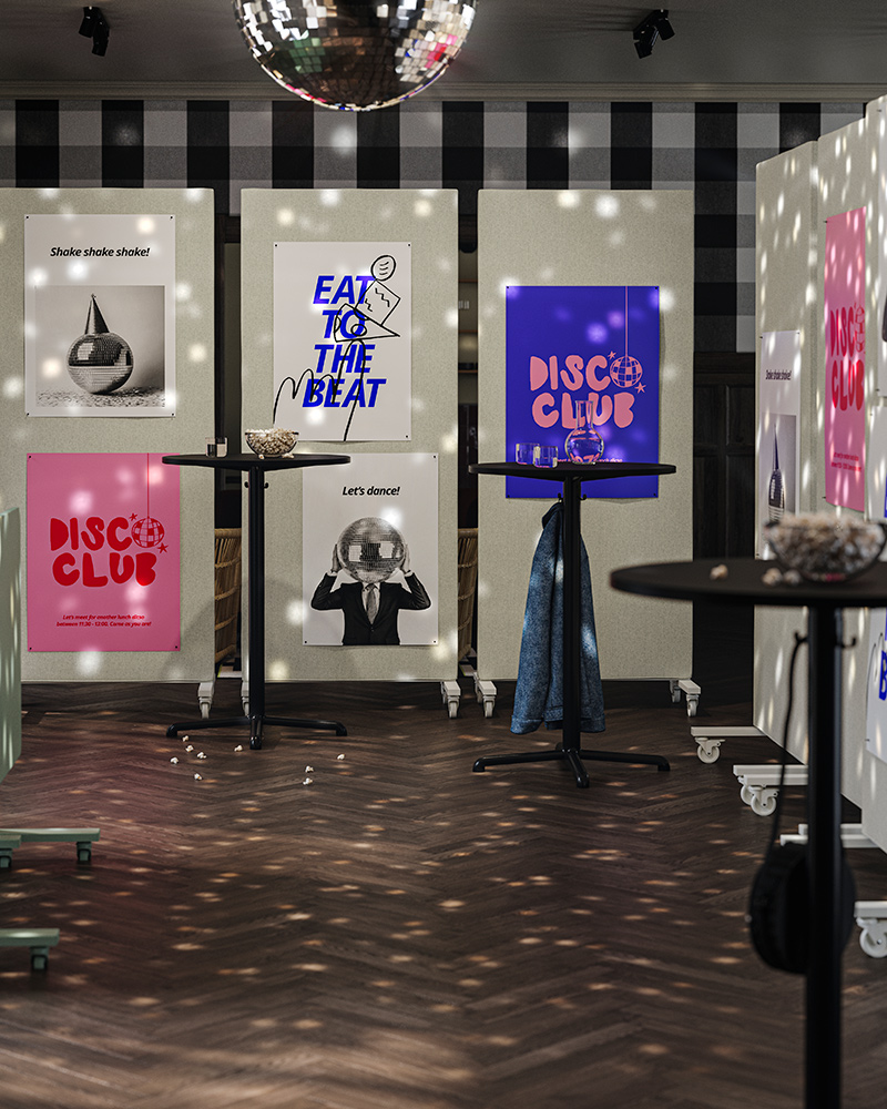 An office break room with a disco ball, where MITTZON frames create a closed-off space with foldable tables on the side.