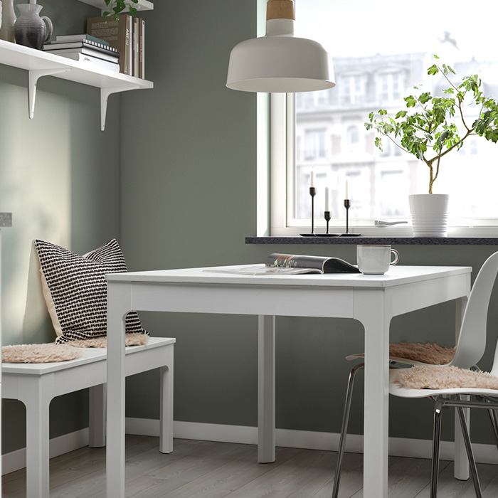 dining room consisting of a table, a stool, chairs and cushions, a lamp, etc.