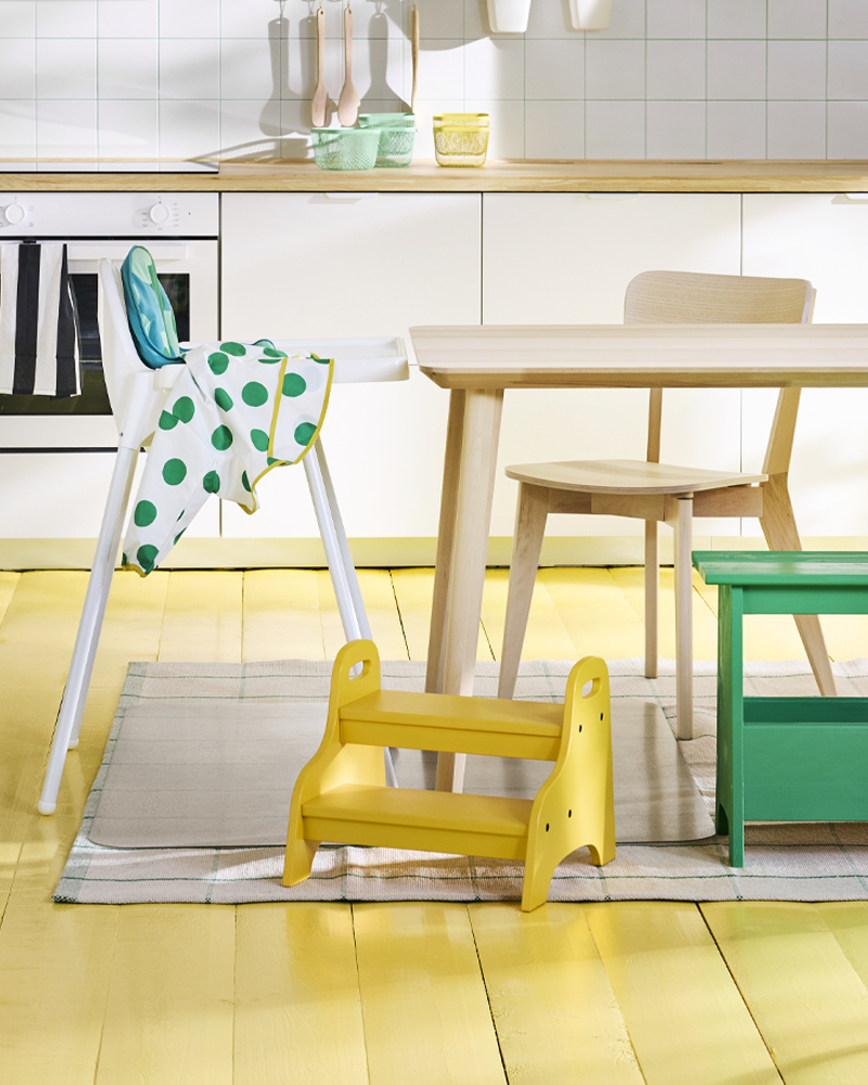 Bright family kitchen featuring the TROGEN step stool—perfect for kids to reach, help out, and move freely with confidence.